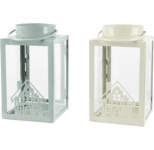 Två dekorativa lyktor i metall med husmotiv och glasinsatser