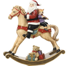 Juldekoration med jultomte, katt och teddybjörn på gunghäst