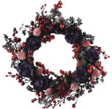 Dekorativ höstkrans med pumpor och bär