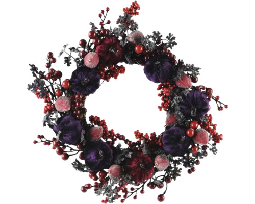 Dekorativ höstkrans med pumpor och bär