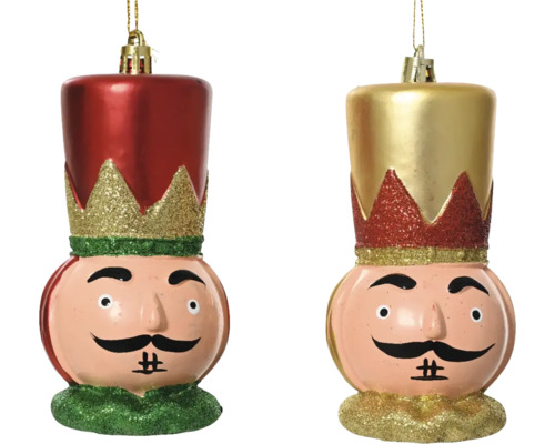 Två nötknäppare julgranskulor med ansikten och hattar