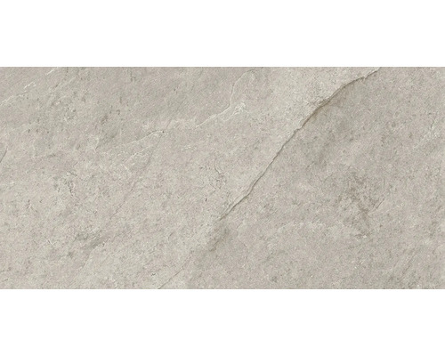 Närbild av en grå golvplatta med matt finish