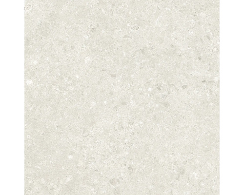 Närbild av en ljus keramisk platta med spräcklig textur