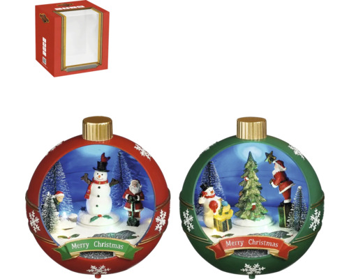 Två julgranskulor med julscener och en röd förpackning