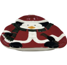 Dekorativ skål i form av en pingvin med julhatt och halsduk