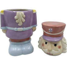 Dekorativ nötknäpparfigur som blomvas