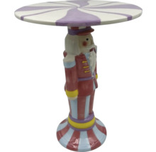 Dekorativt bord i form av en nötknäppare med randig bordsskiva