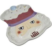 Dekorativ tallrik med nötknäppare ansikte