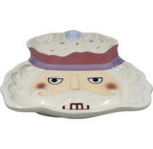 Dekorativ keramisk skål med ansikte och huvudbonad