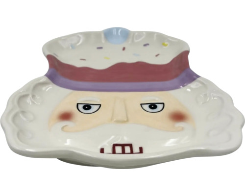 Dekorativ keramisk skål med ansikte och huvudbonad