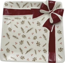 Dekorativ tallrik med rosettmönster