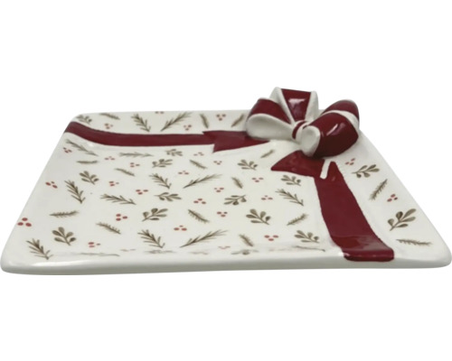 Dekorativ rektangulär serveringsplatta med rosettmotiv och växtmönster.