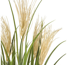 Dekorativa konstgjorda gräs med filigranstjälkar och gröna blad