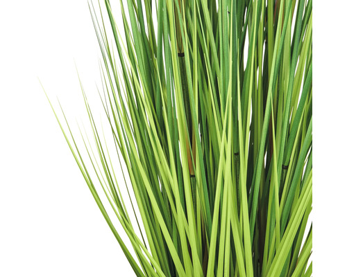 Konstgjord grästuva med gröna strån och bambupinnar som dekoration