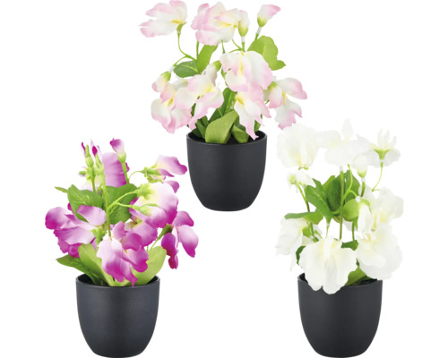 Tre konstgjorda blommor i svarta krukor