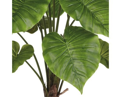 Detaljbild av en konstgjord Alocasia krukväxt med stora gröna blad.