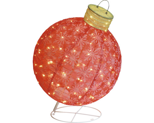 Dekorativ julgranskula med snöflingamönster och belysning på ett stativ