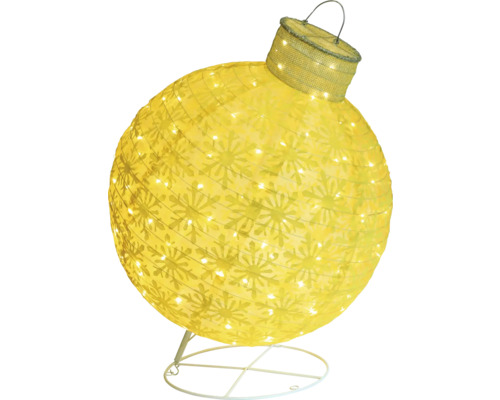 Gul julgranskula med snöflingamönster och belysning på ett stativ