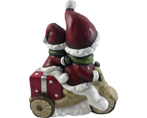 Juldekoration med två tomtar på en motorcykel med en present