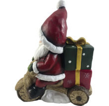 Jultomtefigur på trämotorcykel med presenter