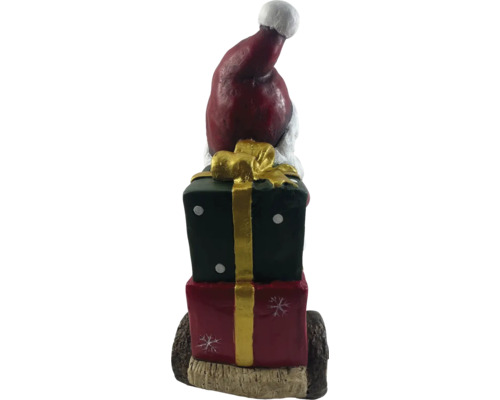 Dekorativ figur jultomte på presenter