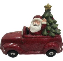 Juldekoration: Jultomte i bil med julgran