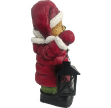 Dekorativ jultomtefigur med lykta som festlig dekoration