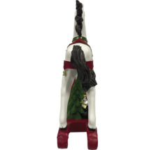 Dekorativ hästfigur med julgransdekorationer