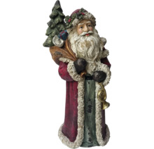 Dekorativ jultomtefigur med säck och träd