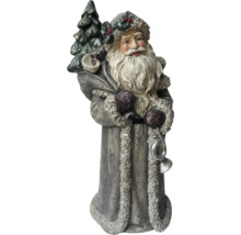 Dekorativ jultomtefigur med träd och present