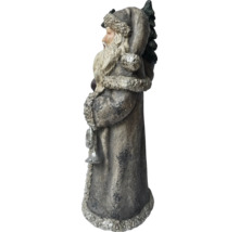 Dekorativ jultomte med julgran och klocka