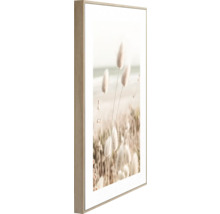 Dekorativ väggbild med blommigt motiv i träram