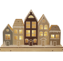 Trädekoration upplysta hus till jul