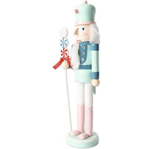 Dekorativ nötknäppare av trä med godispinne