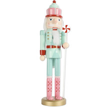 Dekorativ nötknäppare med godistema som juldekoration