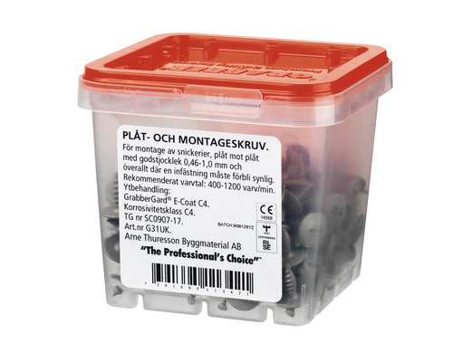 Plåtskruv och monteringsskruv i transparent plastlåda med rött lock
