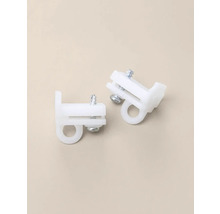 Två vita gardinrullar i plast med skruvar för gardinskenor.