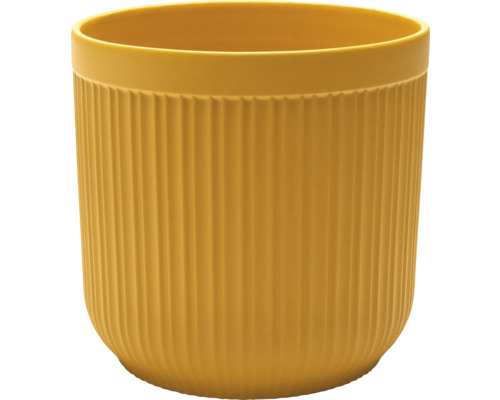 Gul blomkruka med vertikala ribbor.