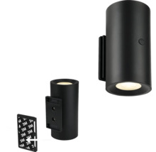 Svart cylindrisk vägglampa med monteringsmaterial