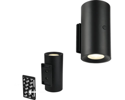 Svart cylindrisk vägglampa med monteringsmaterial
