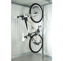 Cykel på en cykelhängare i ett garage