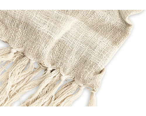 Närbild av en ljus vävd filt med fransar