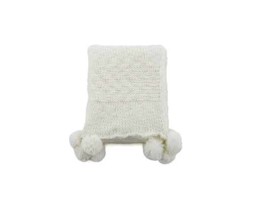 Stickad överkast med tofsar