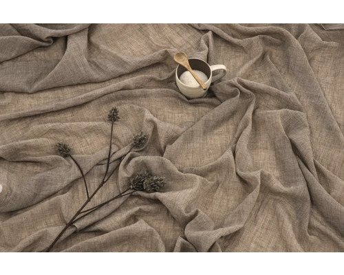 Dekorativ tygbit med mugg, sked och prydnadsväxt