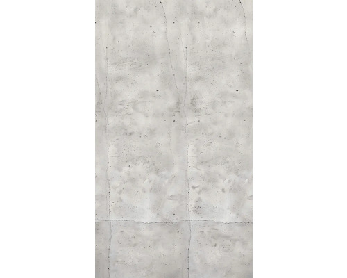 Närbild av en grå betongvägg med sprickor