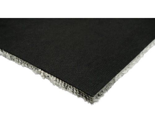 Detaljvy av en matta med textilbaksida och fransar