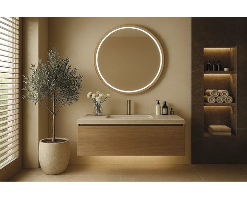 Modernt badrum med rund spegel, tvättställsskåp och hylla