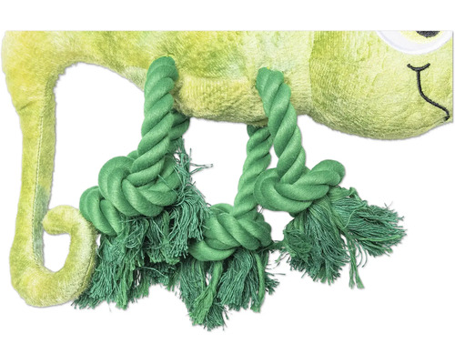 Detaljvy av en grön plyskameleont med repliknande leksak