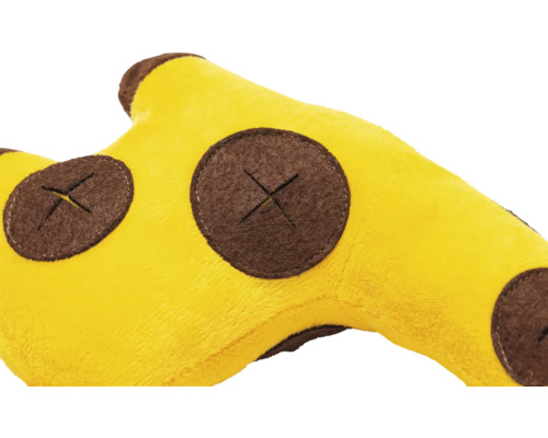 Närbild av ett gult giraffhuvud gosedjur med bruna fläckar