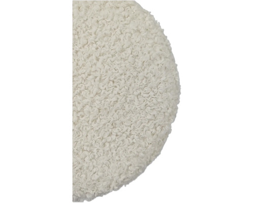 Detaljbild av en rund, texturerad sittdyna